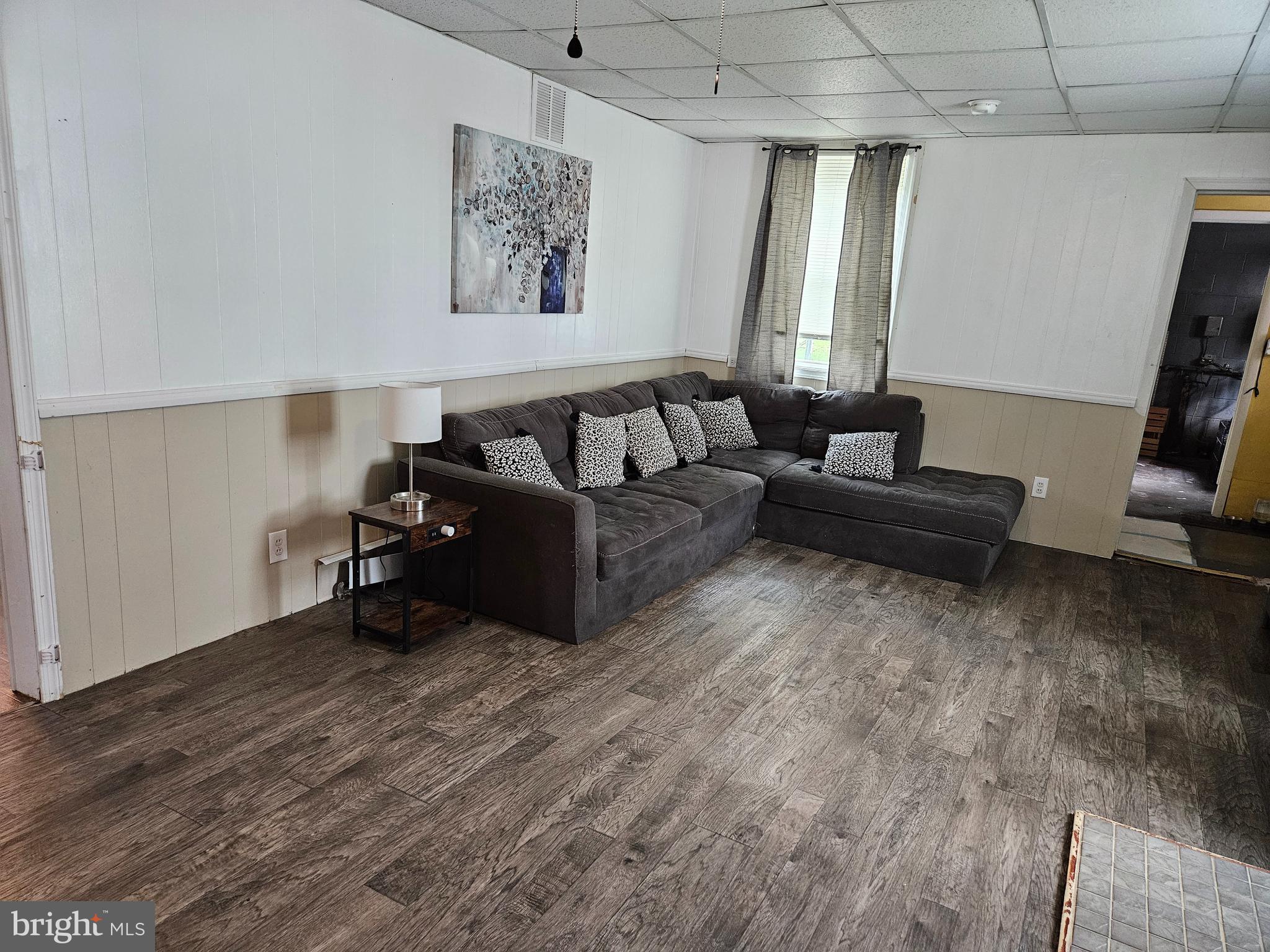 116 Maple Avenue Preston, MD 21655 - Photo 3 of 5 a living room with furniture and a flat screen tv