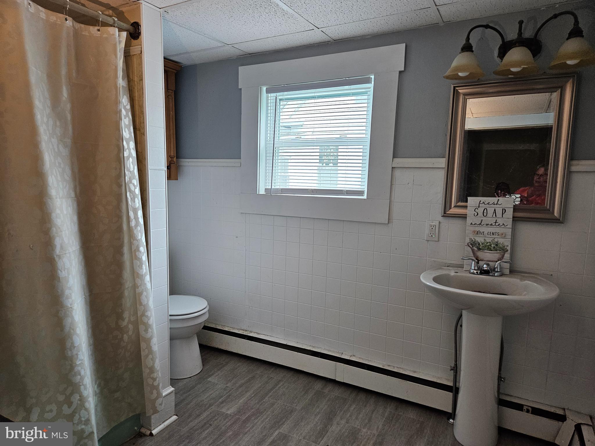 116 Maple Avenue Preston, MD 21655 - Photo 5 of 5 a bathroom with a sink toilet and mirror
