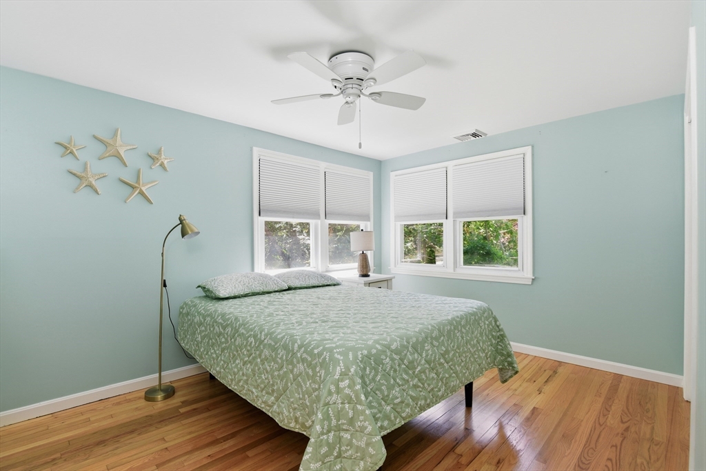 8 Emerald Way Sandwich, MA 02644 - Photo 19 of 36 a bed sitting in a spacious bedroom next to a window