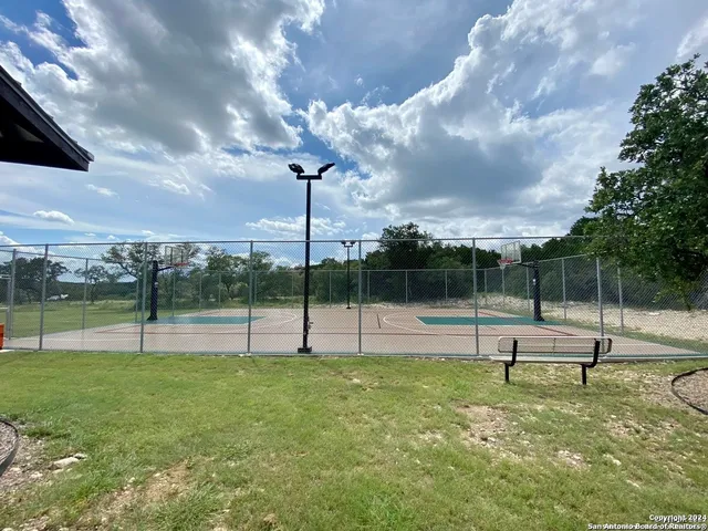 a view of a swimming pool with a patio
