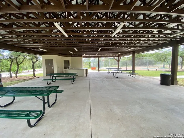 a view of a park with swings and slides