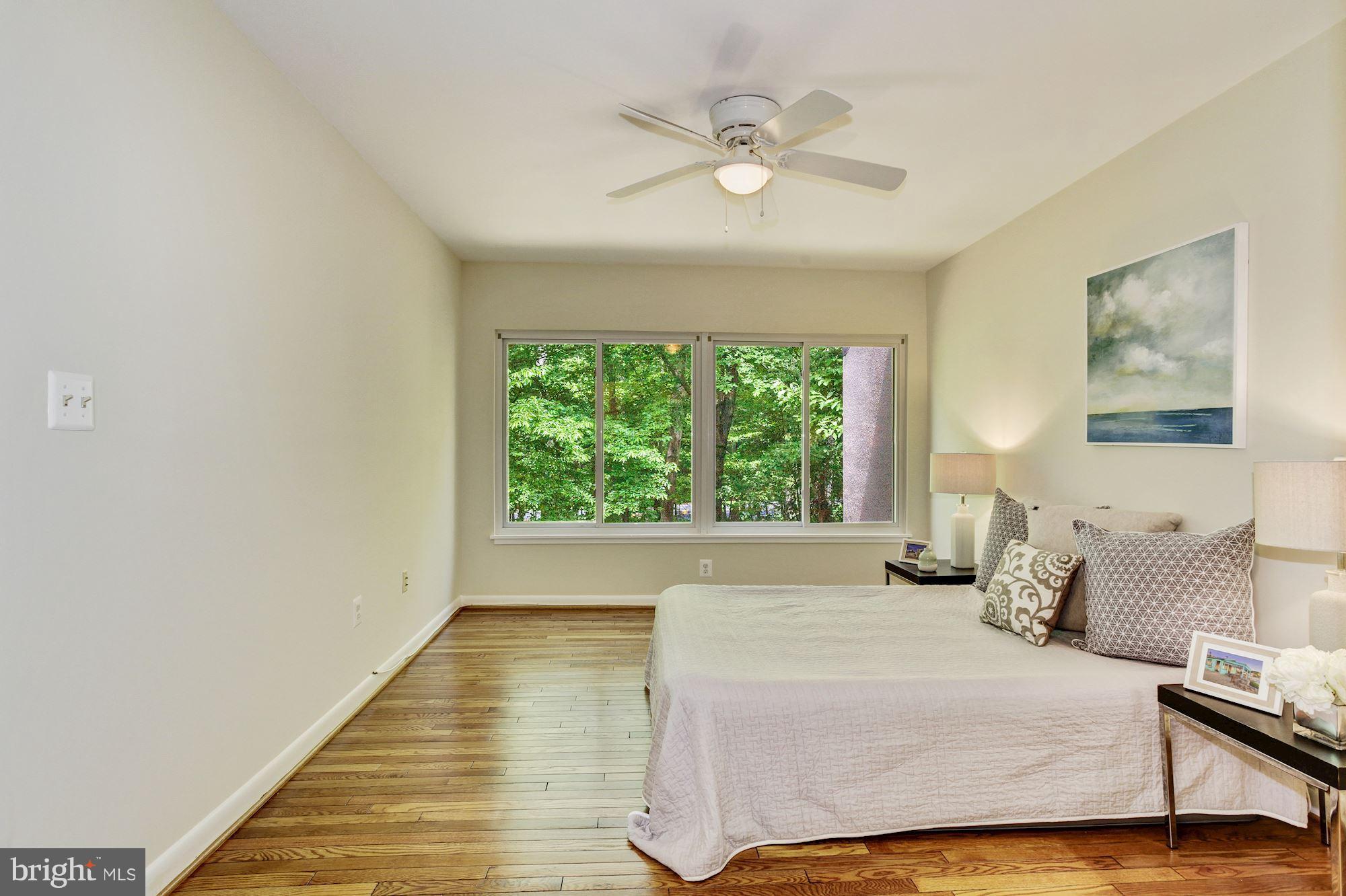 2364 Soft Wind Court Reston, VA 20191 - Photo 14 of 29 Master suite w/ gleaming hardwoods, treelined view