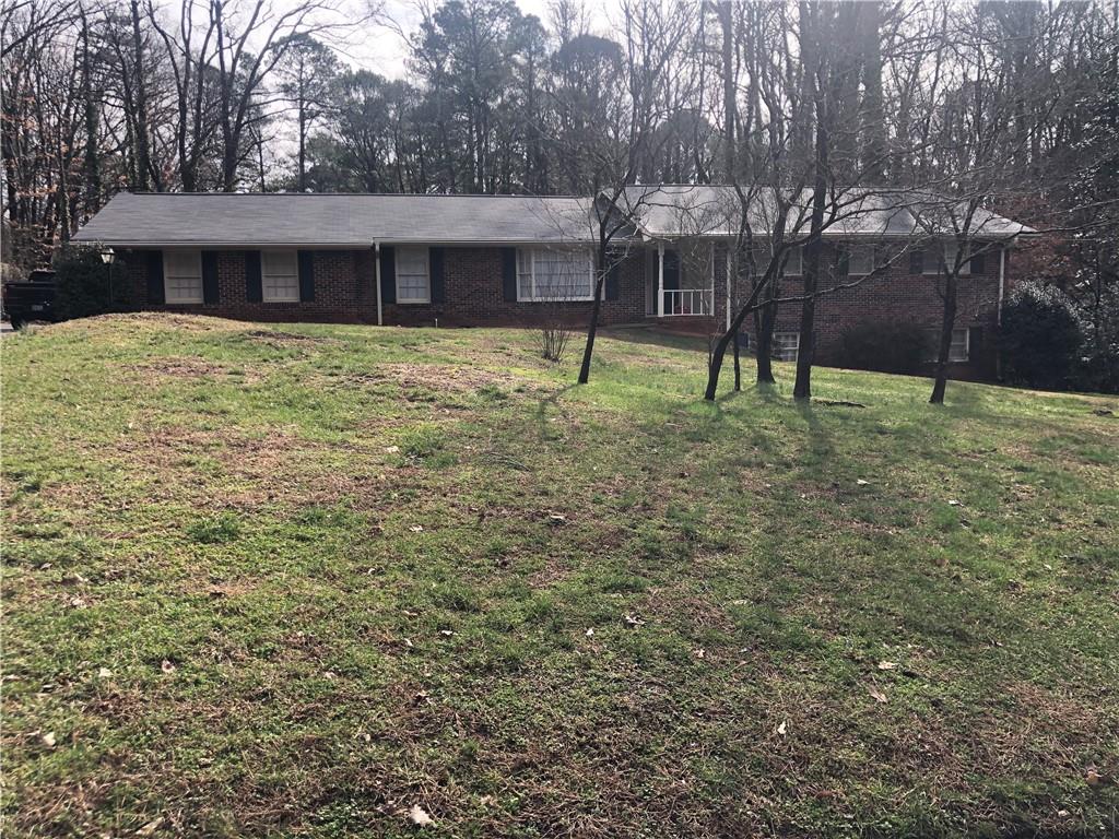 5295 Oxbow Road Stone Mountain, GA 30087 - Photo 1 of 1 a house view with a backyard space