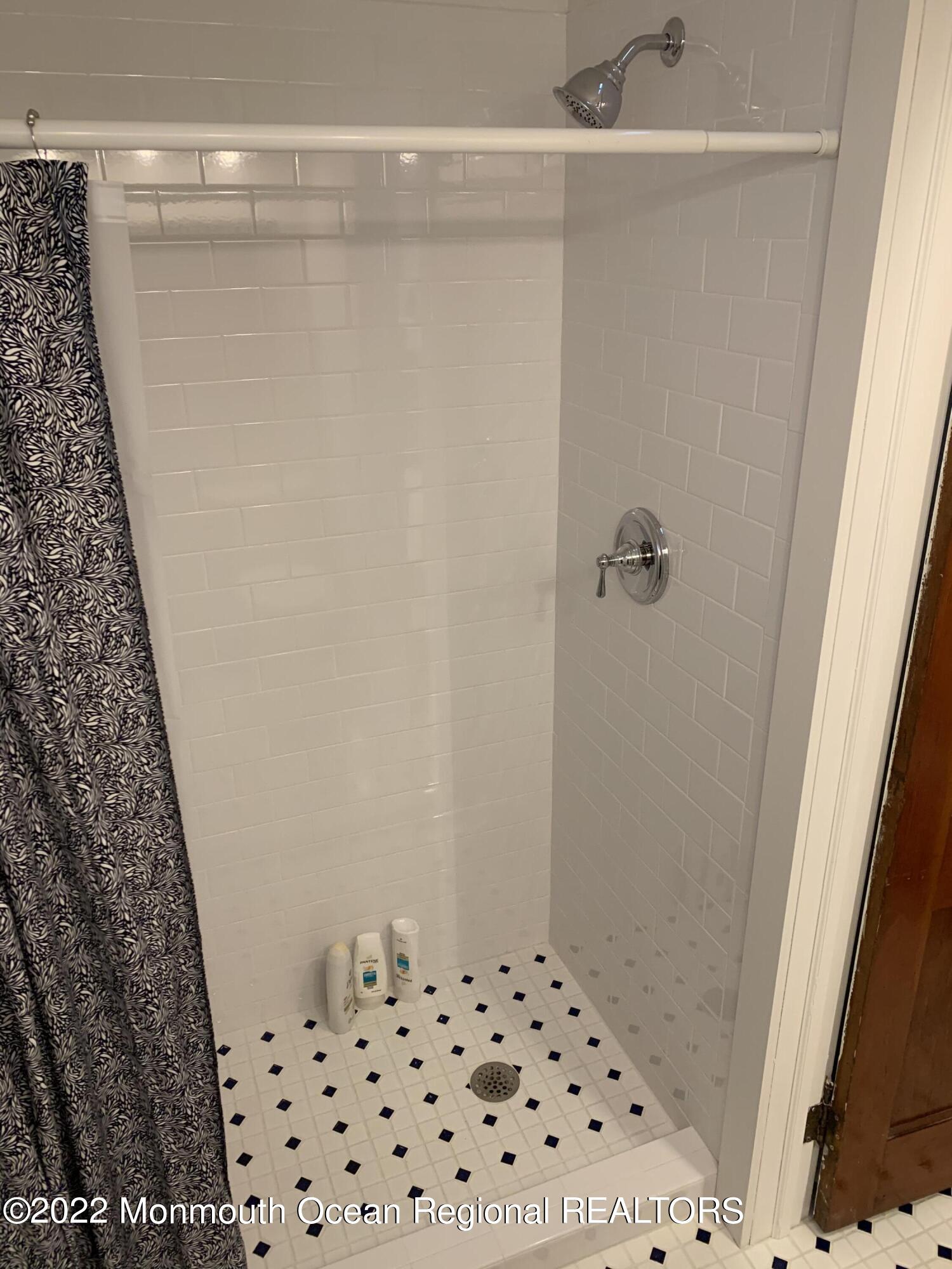 1836 Parkway Belmar, NJ 07719 - Photo 14 of 32 a bathroom with a shower and a sink