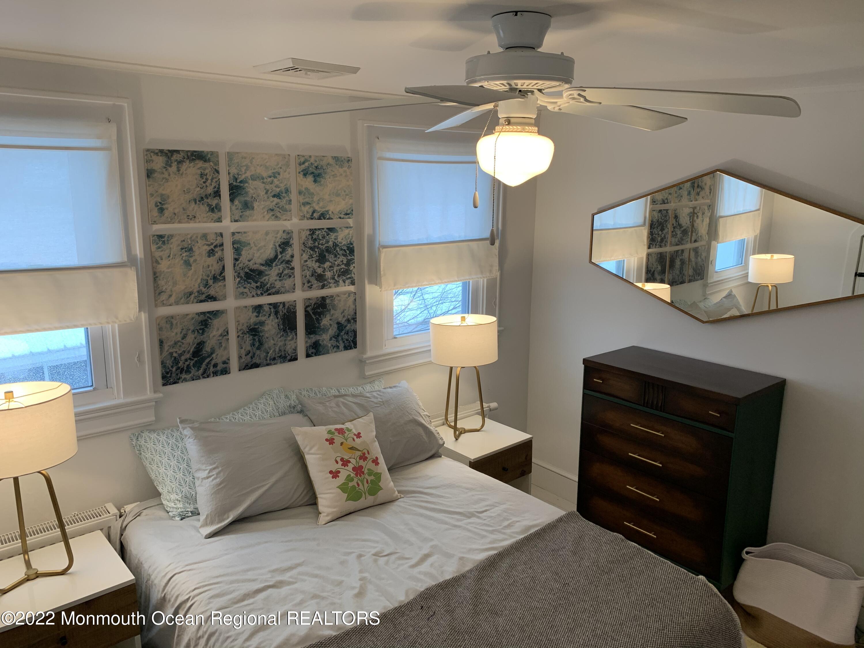 1836 Parkway Belmar, NJ 07719 - Photo 18 of 32 a bedroom with a bed and a mirror on the dresser