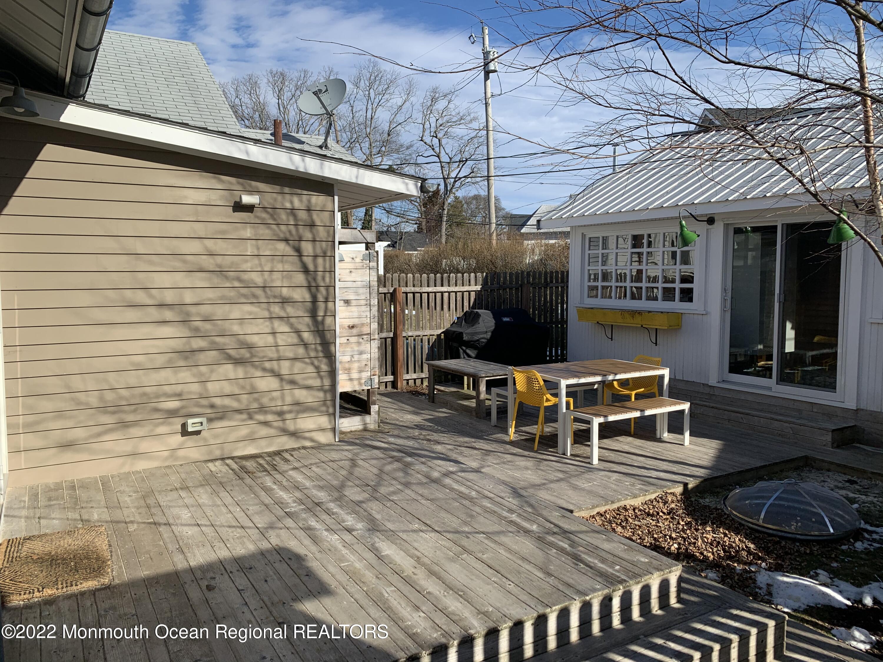 1836 Parkway Belmar, NJ 07719 - Photo 23 of 32 a bench sitting in front of a building
