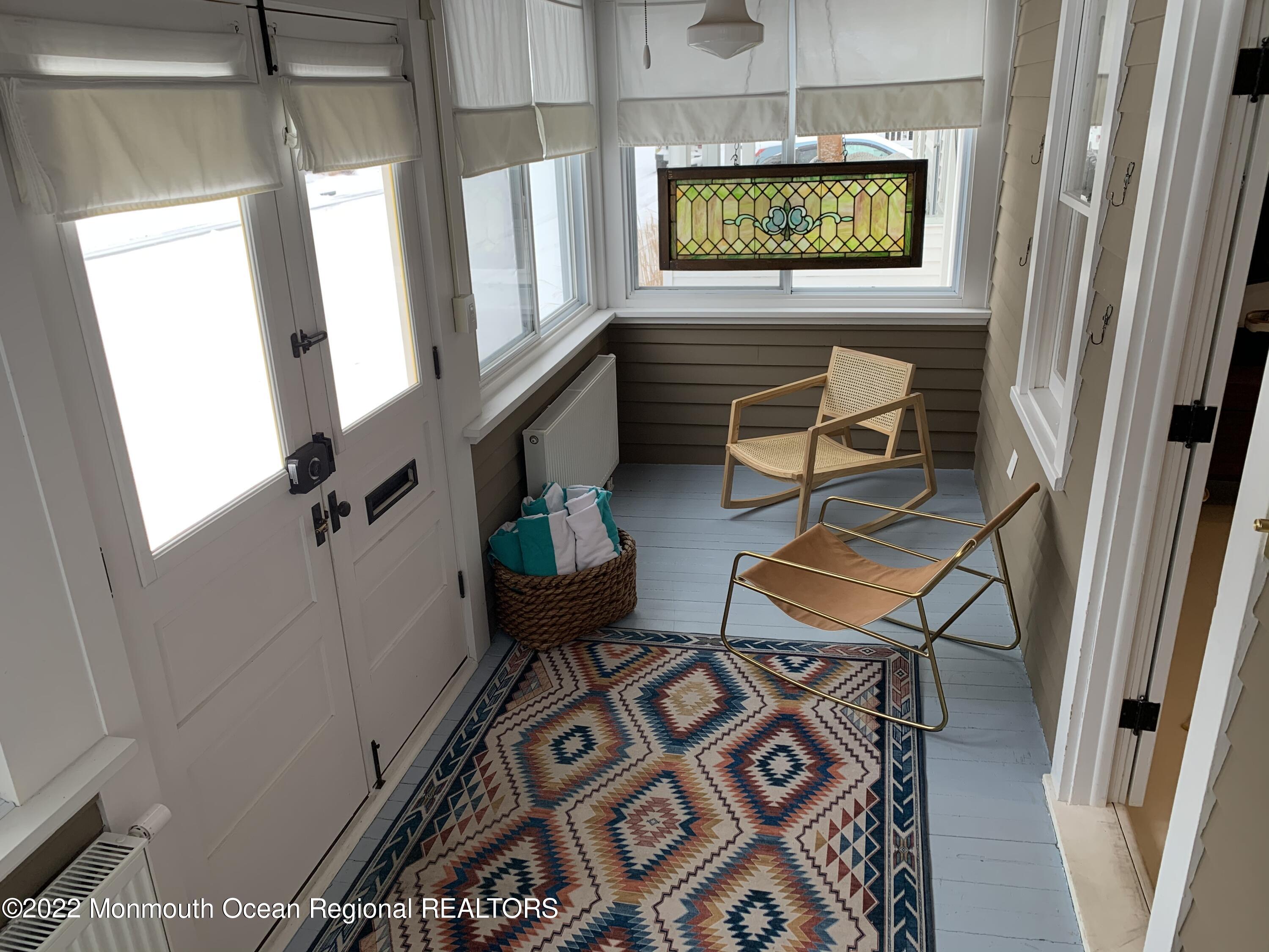 1836 Parkway Belmar, NJ 07719 - Photo 3 of 32 a living room with chairs and a flat screen tv