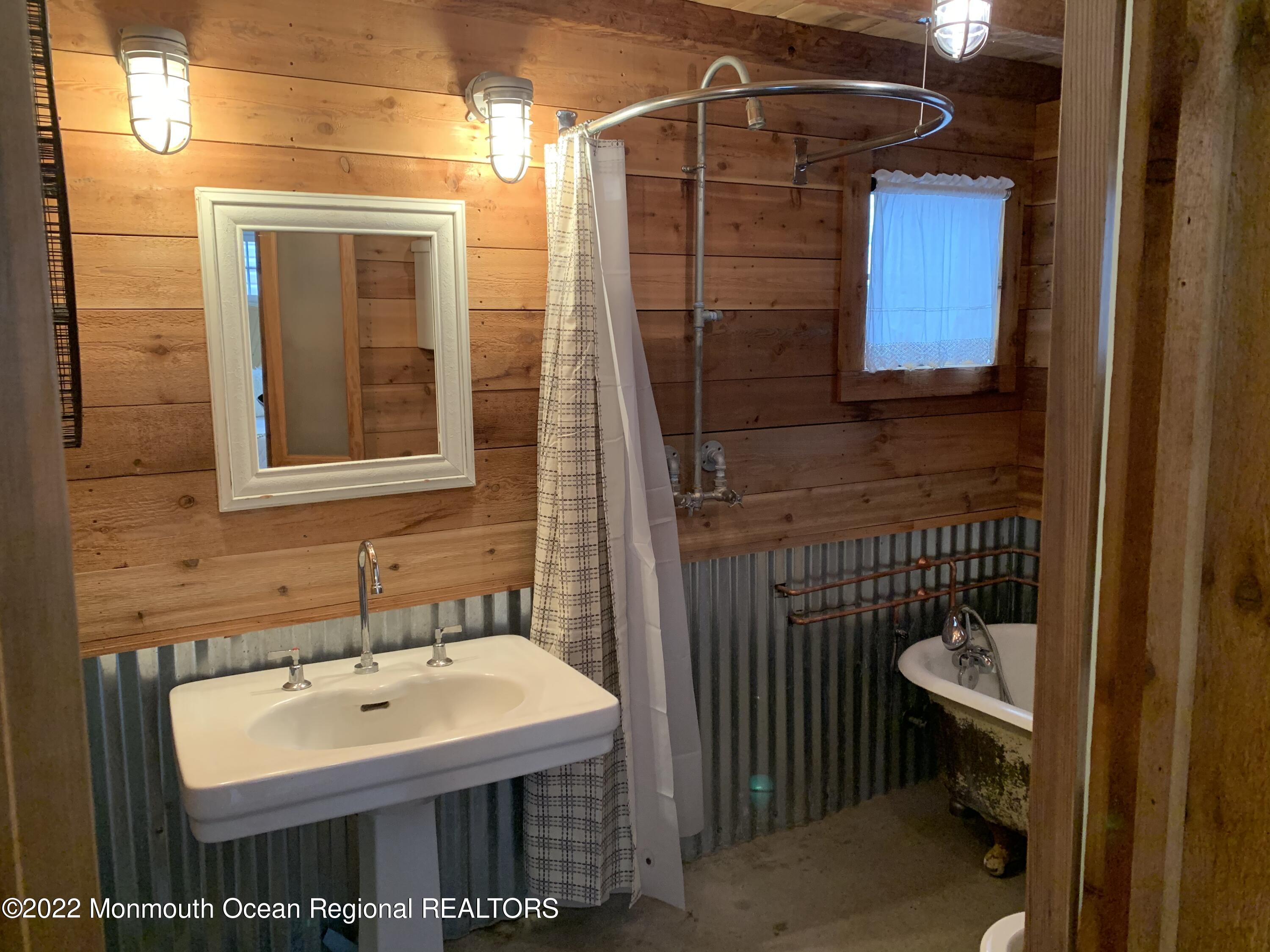 1836 Parkway Belmar, NJ 07719 - Photo 31 of 32 a bathroom with a sink a toilet and shower