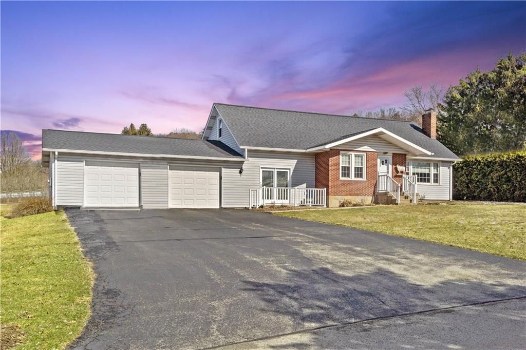 2490 Home Street Indiana, PA 15701 - Photo 2 of 22 a front view of a house with a garden and yard