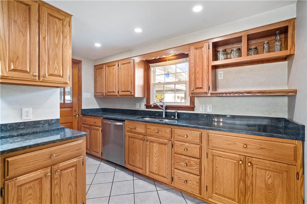 2490 Home Street Indiana, PA 15701 - Photo 7 of 22 a kitchen with granite countertop cabinets stainless steel appliances a sink and a window