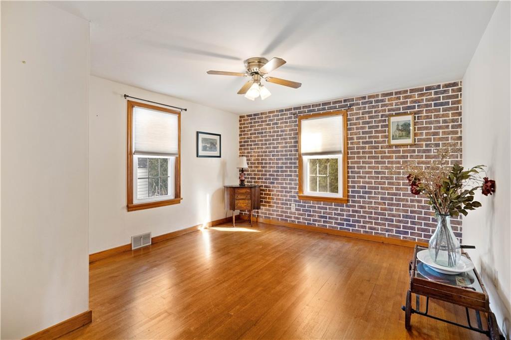 2490 Home Street Indiana, PA 15701 - Photo 10 of 22 a view of a livingroom with wooden floor and a ceiling fan
