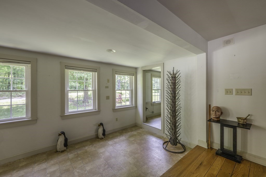 12 West Gill Road Gill, MA 01354 - Photo 16 of 42 a view of an empty room with a window and wooden floor