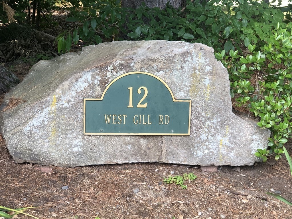 12 West Gill Road Gill, MA 01354 - Photo 2 of 42 a sign that is on the side of a building