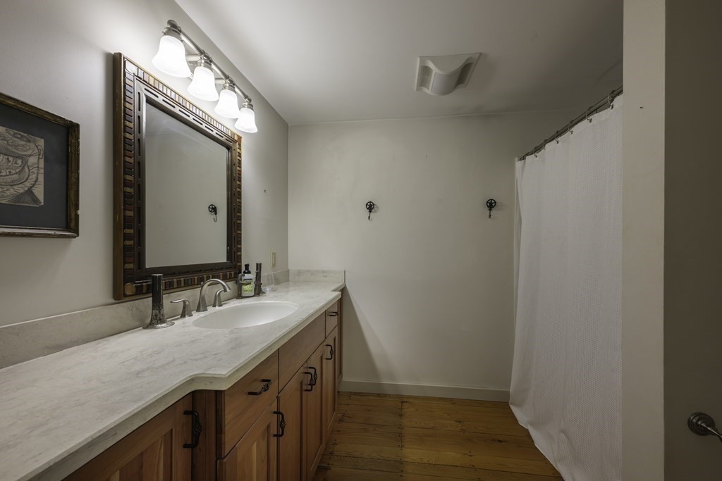 12 West Gill Road Gill, MA 01354 - Photo 25 of 42 a bathroom with a sink and a mirror