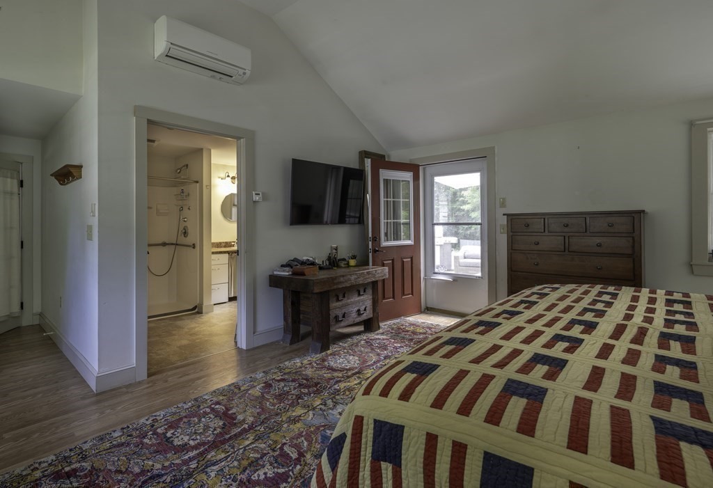 12 West Gill Road Gill, MA 01354 - Photo 28 of 42 a bedroom with a bed and wooden floor