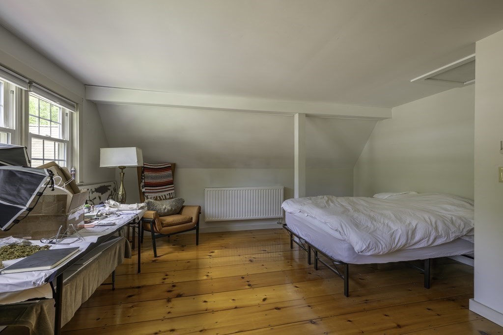 12 West Gill Road Gill, MA 01354 - Photo 32 of 42 a bedroom with a bed and wooden floor
