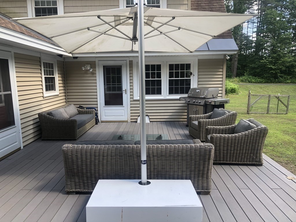 12 West Gill Road Gill, MA 01354 - Photo 35 of 42 a view of a patio with couches chairs and wooden floor