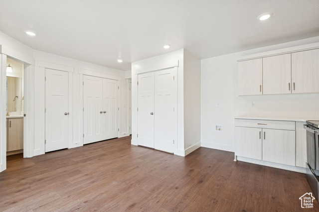 1615 North Angel Street, Unit I Layton, UT 84041 - Photo 30 of 56 Unfurnished dining area with recessed lighting and dark wood-style flooring