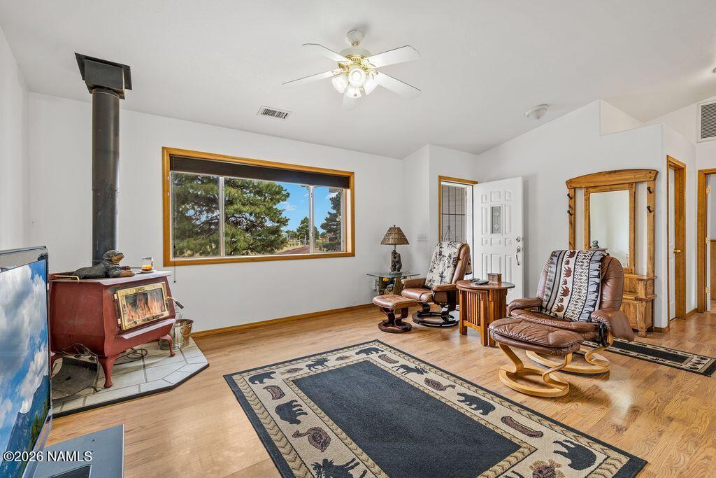 7597 Conley Road Flagstaff, AZ 86004 - Photo 14 of 38 a living room with furniture gym equipment and a window