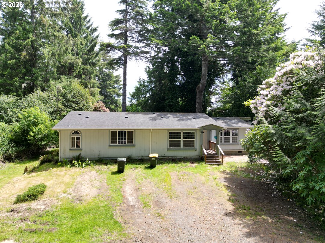 83411 Clear Lake Road Florence, OR 97439 - Photo 1 of 47 a house that has tree in front of it