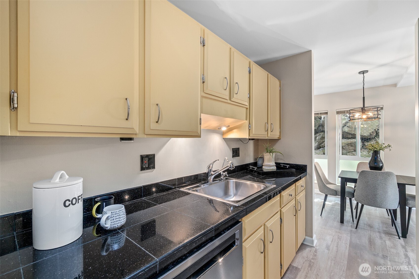 75 East Lynn Street, Unit B Seattle, WA 98102 - Photo 11 of 36 a kitchen that has a sink and a stove