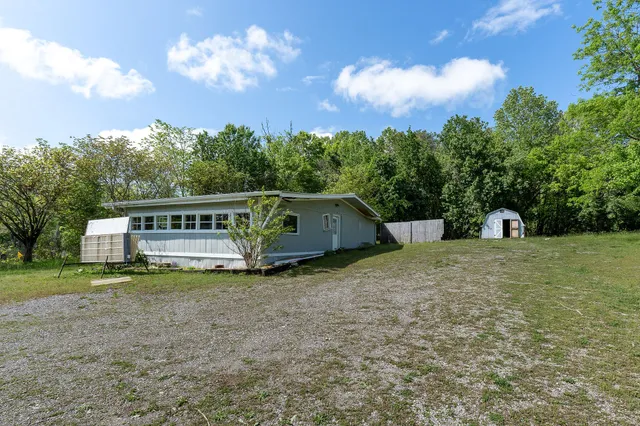 a house with trees in the background