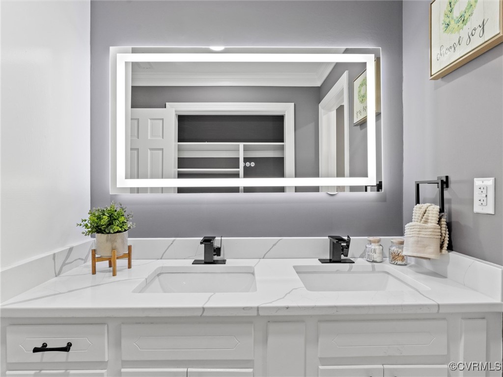 4815 Burnham Road North Chesterfield, VA 23234 - Photo 10 of 48 Bathroom featuring a sink, double vanity, and crow