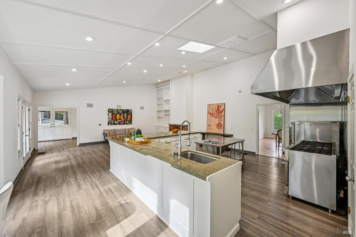 5 Maoli Drive San Rafael, CA 94903 - Photo 15 of 74 a kitchen with stainless steel appliances granite countertop a sink stove and wooden floor