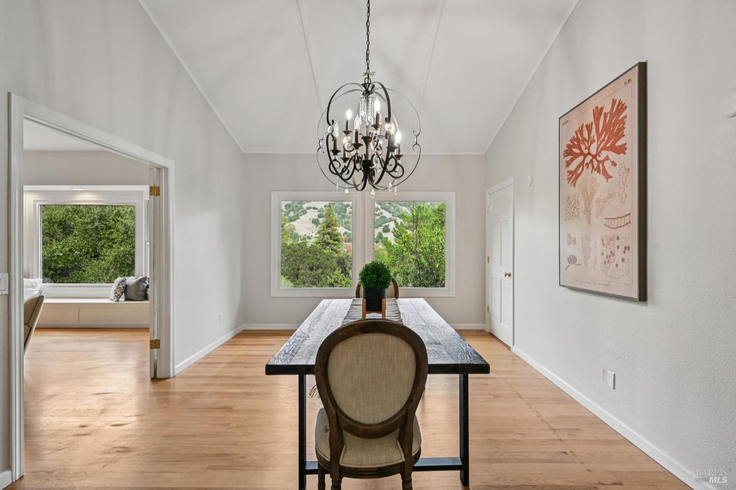 5 Maoli Drive San Rafael, CA 94903 - Photo 23 of 74 a dining room with furniture a window and a chandelier