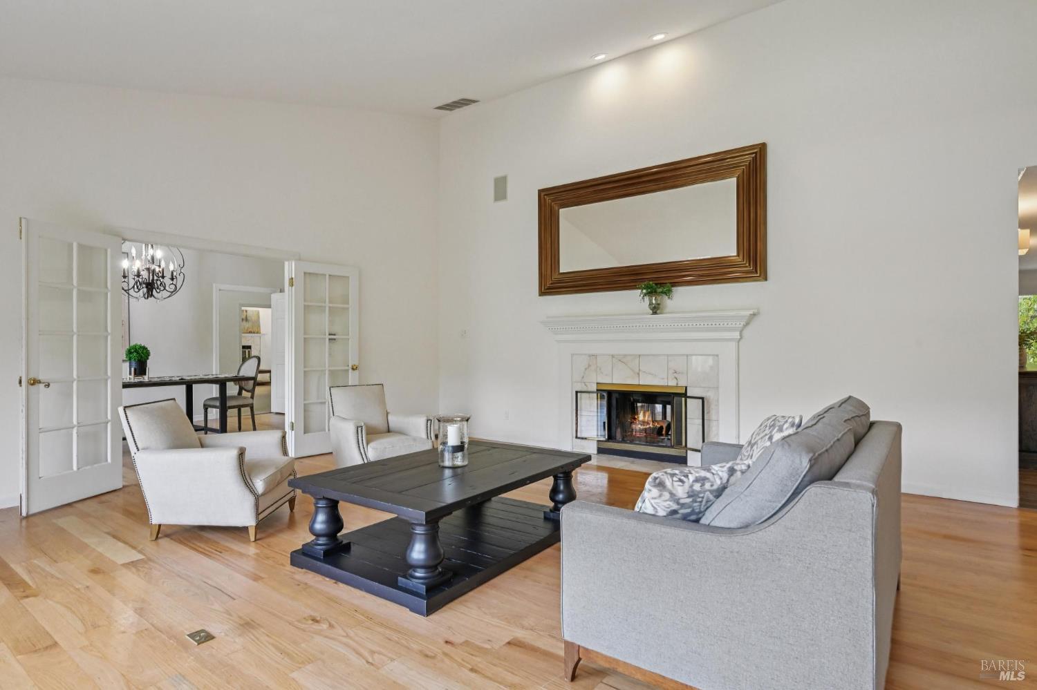 5 Maoli Drive San Rafael, CA 94903 - Photo 31 of 74 a living room with furniture a flat screen tv and a fireplace