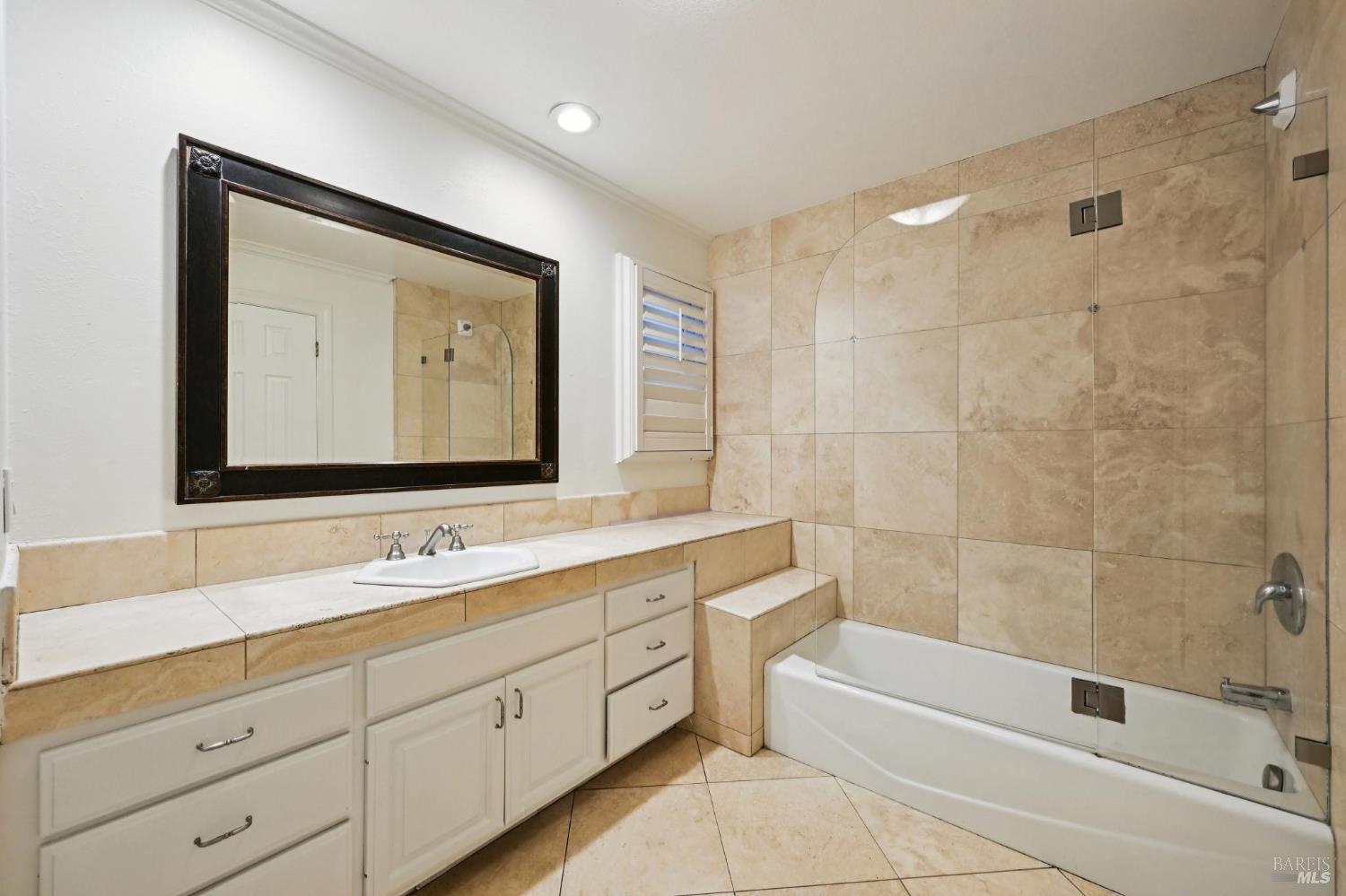 5 Maoli Drive San Rafael, CA 94903 - Photo 42 of 74 a bathroom with a double vanity sink mirror double and bathtub