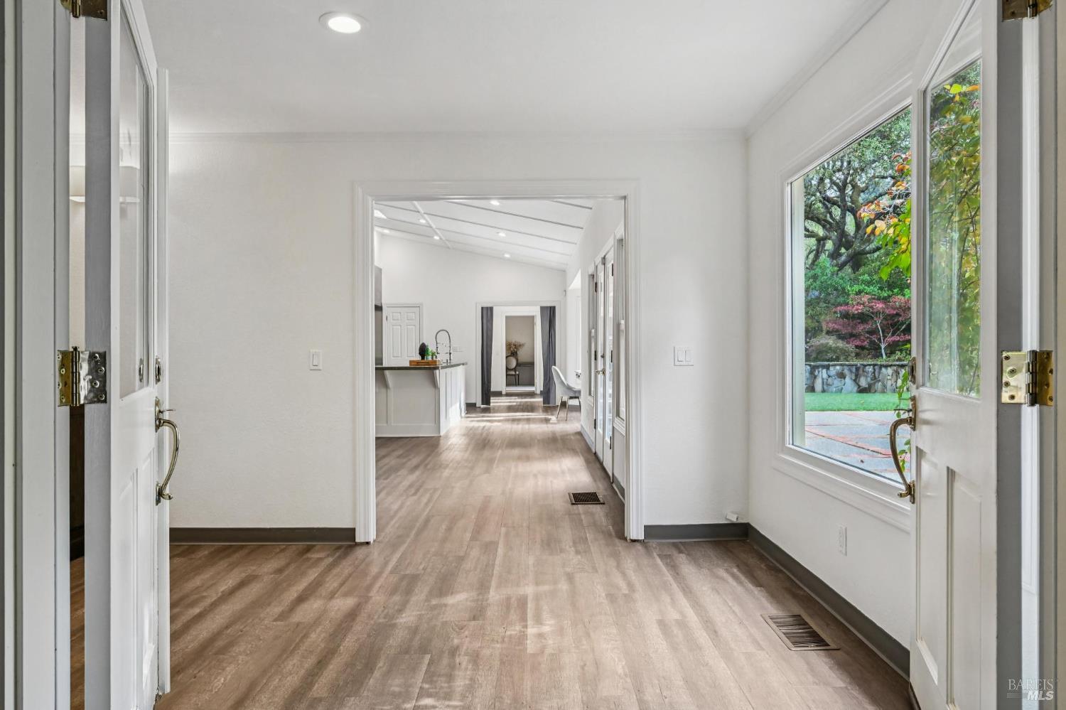 5 Maoli Drive San Rafael, CA 94903 - Photo 9 of 74 a view of a hallway with wooden floor and a bedroom