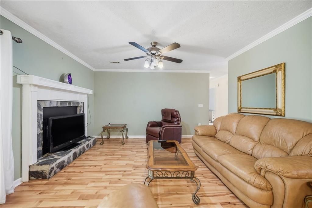 3170 Wages Circle Dacula, GA 30019 - Photo 11 of 39 a living room with furniture and a fireplace