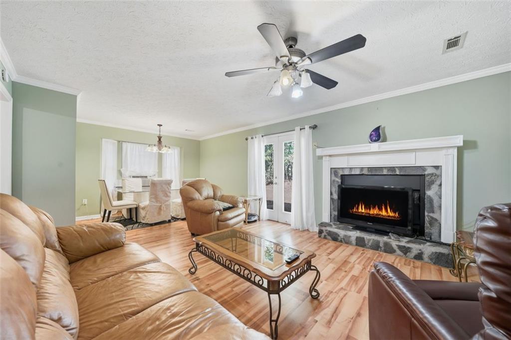 3170 Wages Circle Dacula, GA 30019 - Photo 13 of 39 a living room with furniture and a fireplace