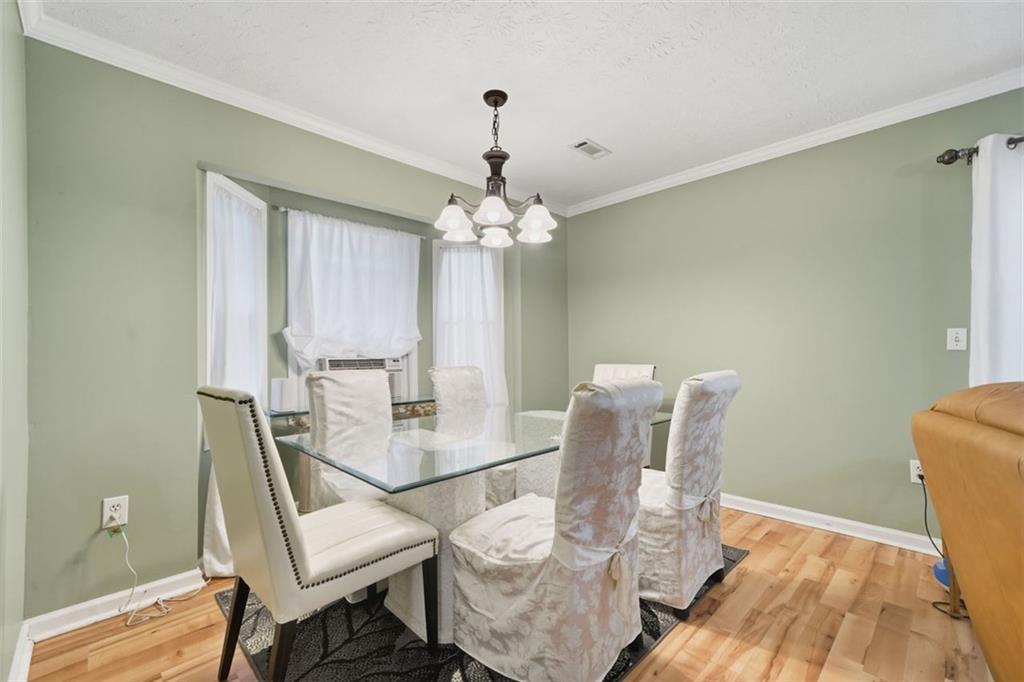 3170 Wages Circle Dacula, GA 30019 - Photo 14 of 39 a dining room with furniture and window