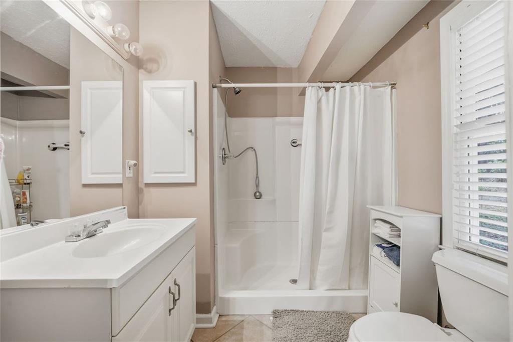 3170 Wages Circle Dacula, GA 30019 - Photo 19 of 39 a bathroom with a sink toilet and shower