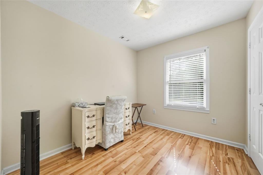3170 Wages Circle Dacula, GA 30019 - Photo 21 of 39 a living room with furniture and wooden floor