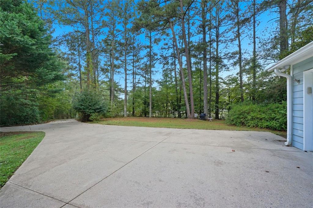 3170 Wages Circle Dacula, GA 30019 - Photo 28 of 39 a view of a field with trees in front of main