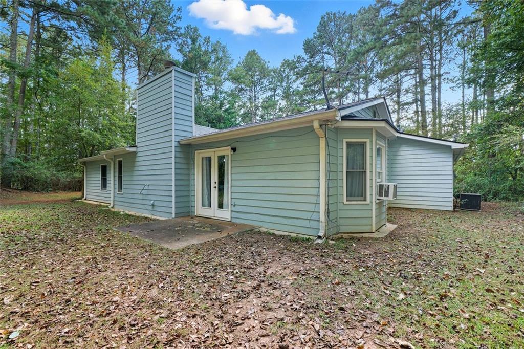 3170 Wages Circle Dacula, GA 30019 - Photo 32 of 39 a view of a house with a yard and large tree