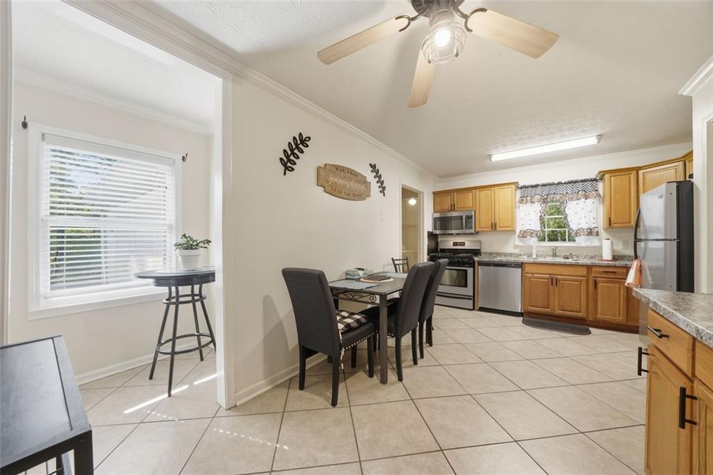 3170 Wages Circle Dacula, GA 30019 - Photo 5 of 39 a view of a dining room with furniture and chandelier