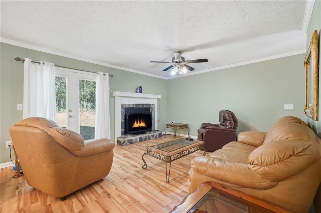 3170 Wages Circle Dacula, GA 30019 - Photo 10 of 39 a living room with furniture and a fireplace