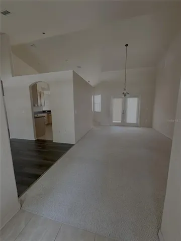a view of an empty room with stairs