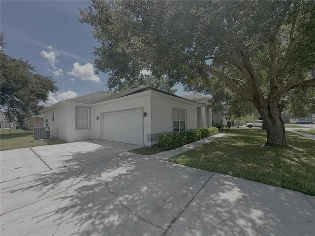 a house view with a backyard space