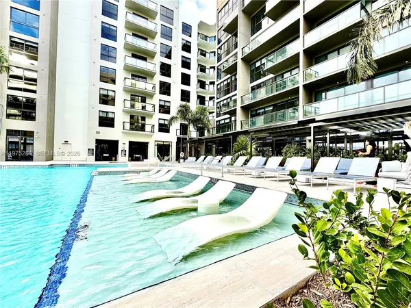 a view of building with outdoor space and seating area