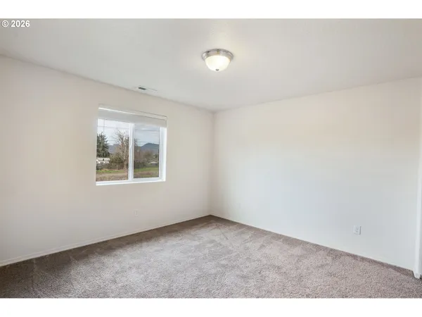 a bathroom with a sink toilet a mirror and shower