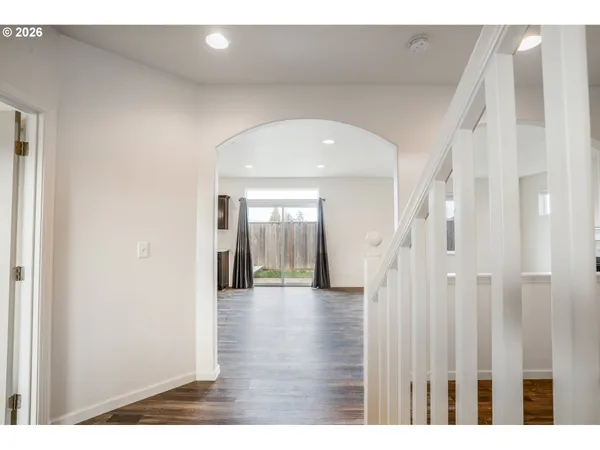 a view of an entryway with wooden floor