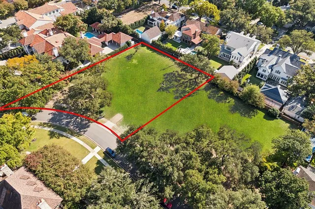 an aerial view of a residential houses with outdoor space