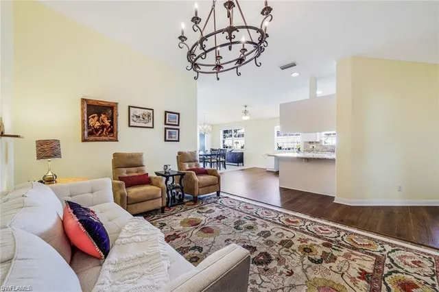 a bedroom with furniture and a rug