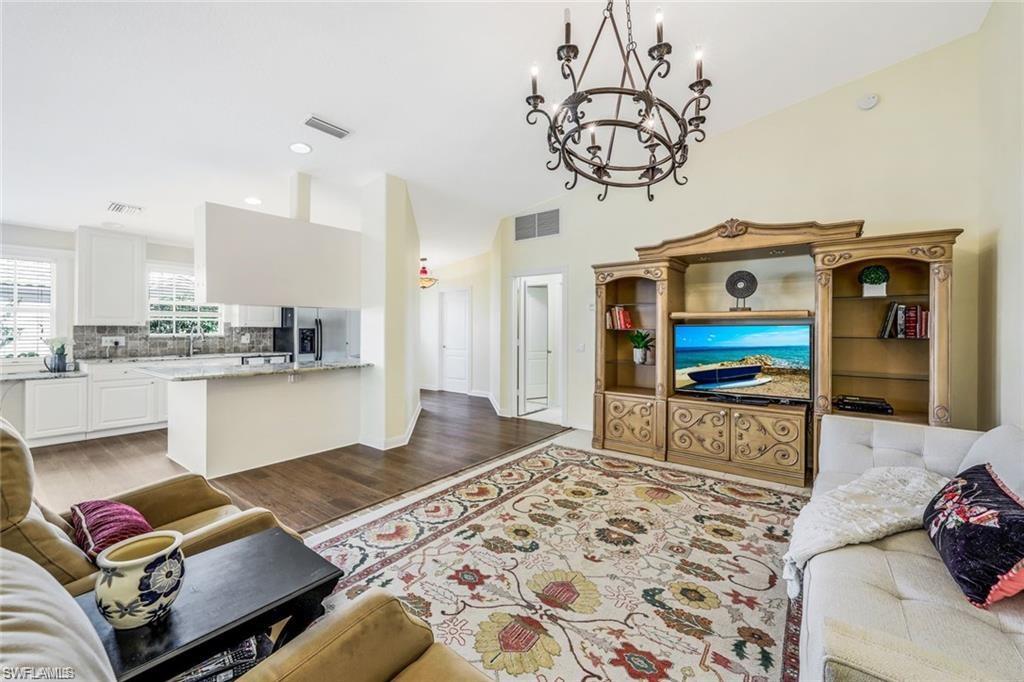 4823 Lasqueti Way Naples, FL 34119 - Photo 5 of 35 a living room with furniture and flat screen tv