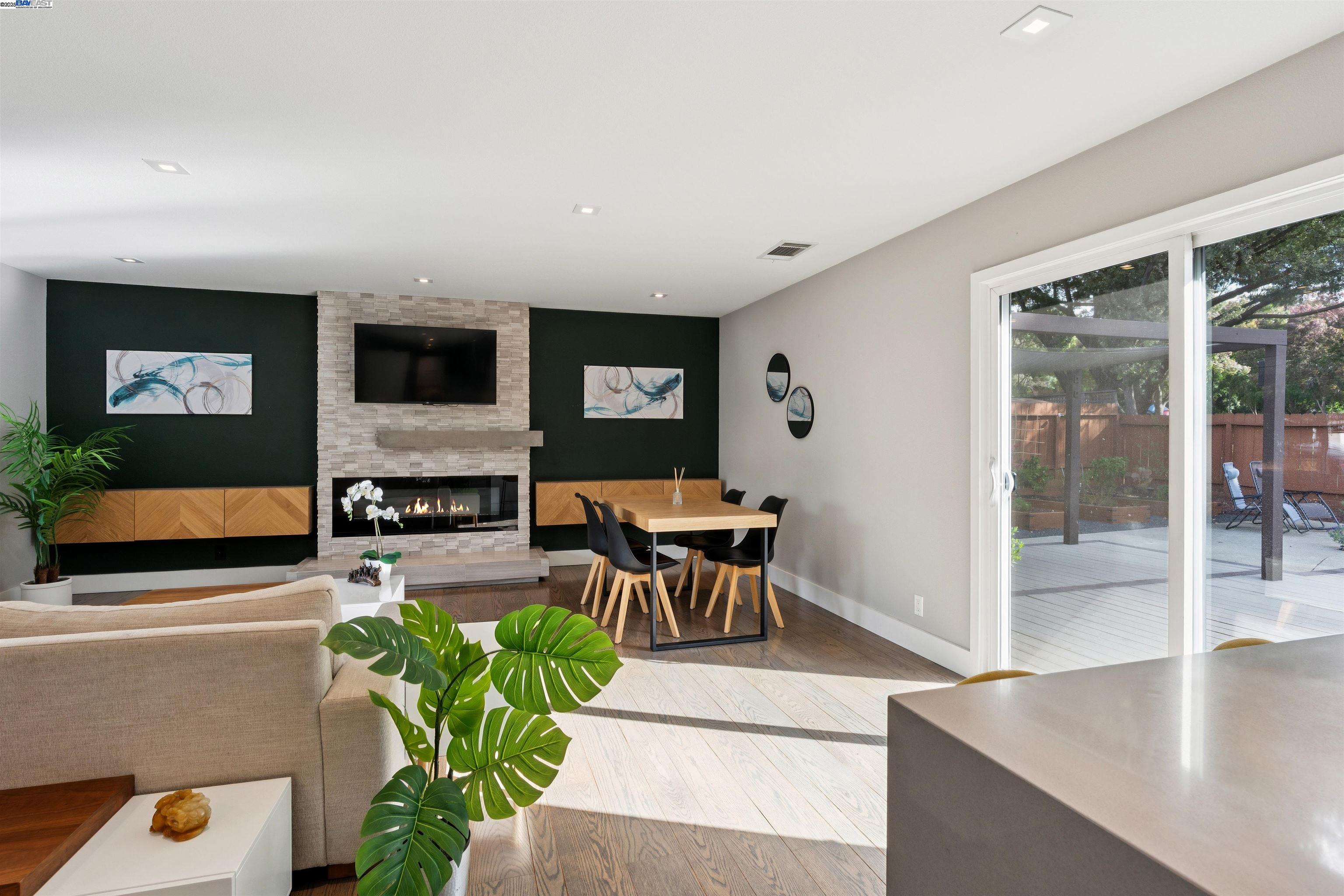 1230 Hale Drive Concord, CA 94518 - Photo 13 of 60 a living room with furniture a flat screen tv and a fireplace